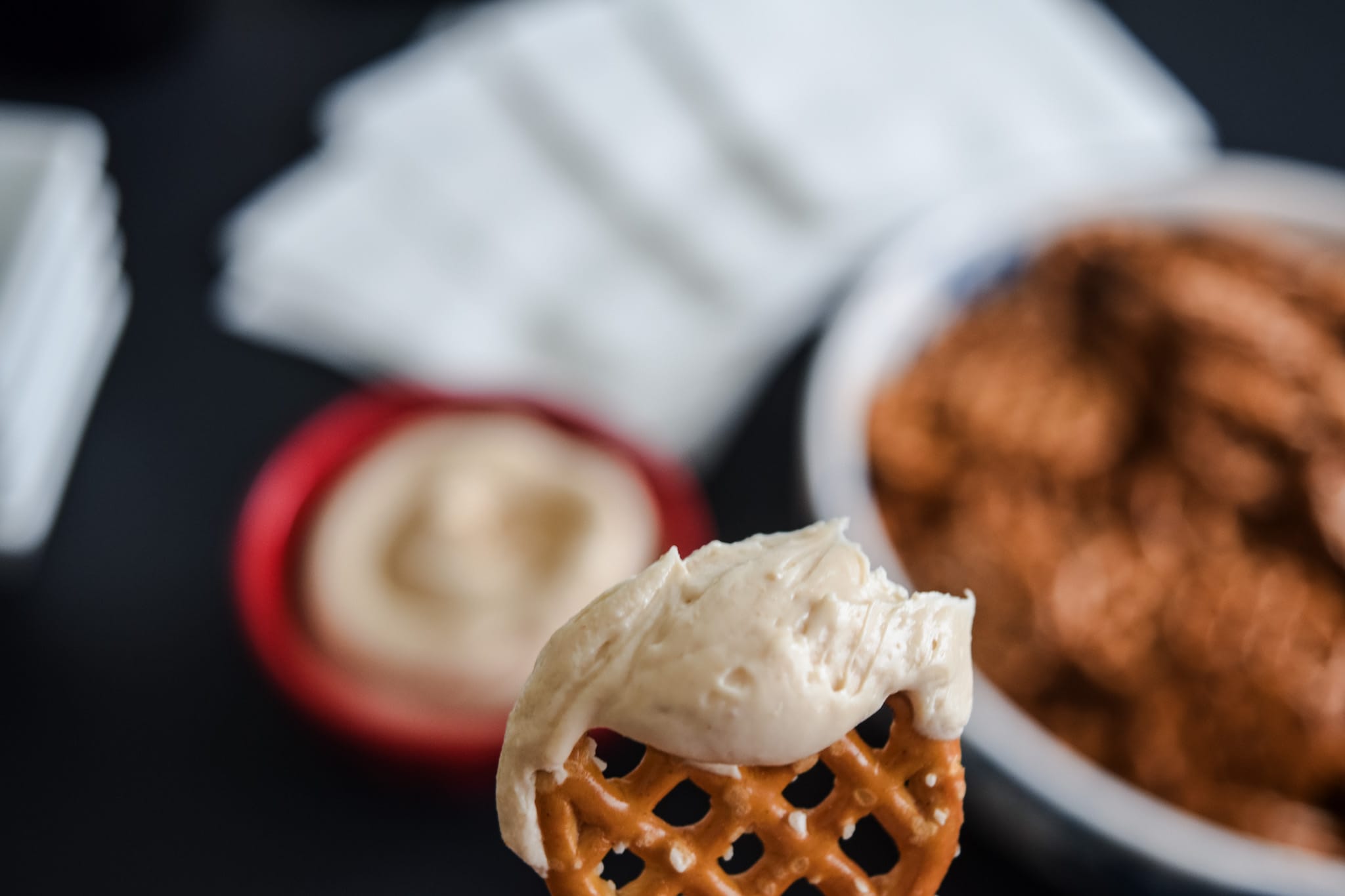 close-up mini pretzel with creamy peanut butter dip