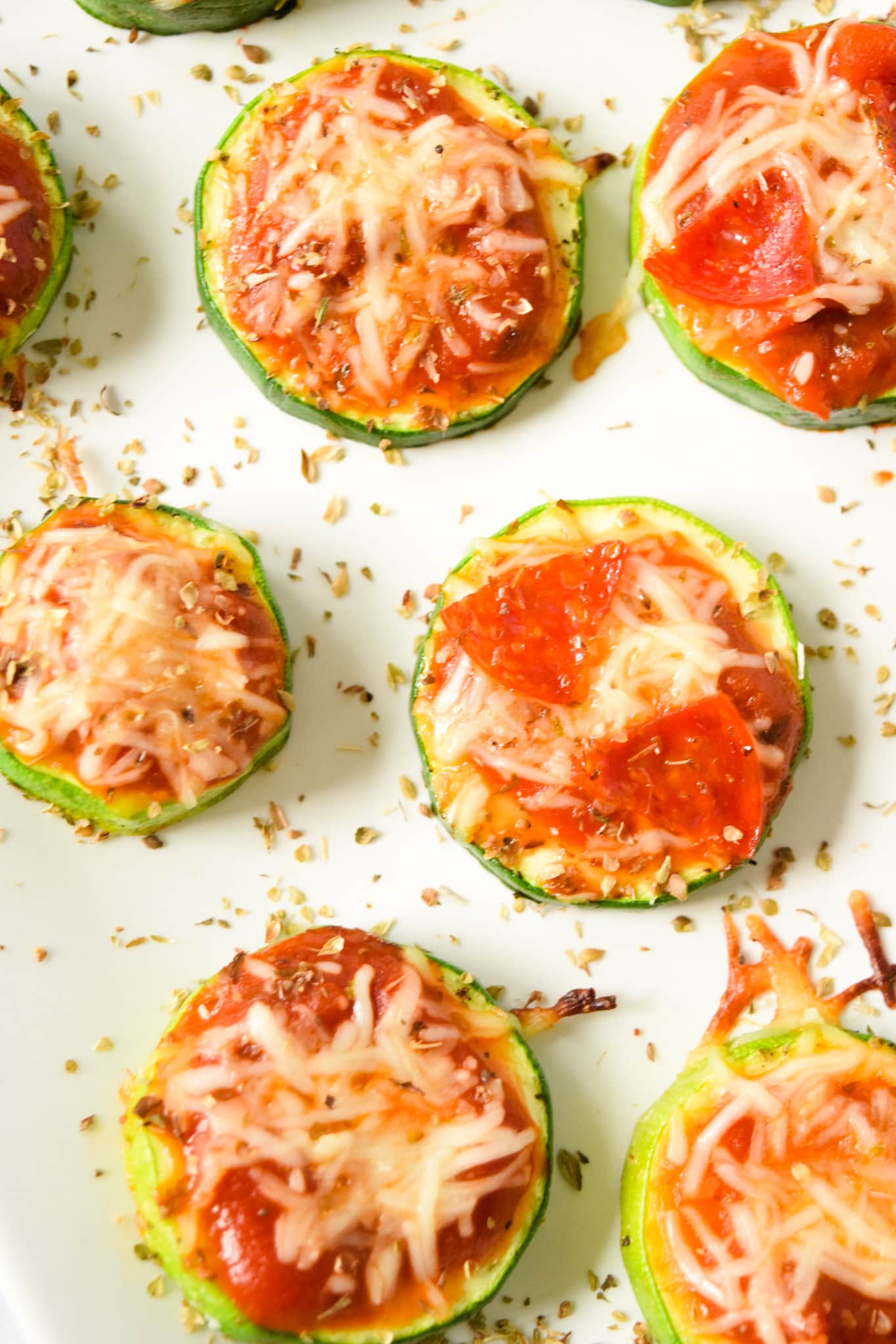 Zucchini Pizza Rounds on White Plate
