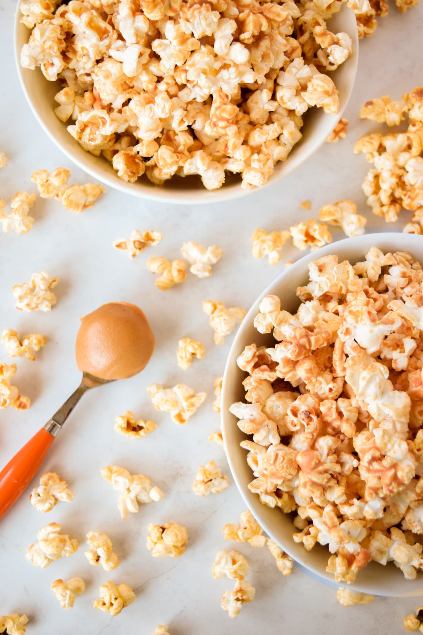 White bowls with peanut butter popcorn