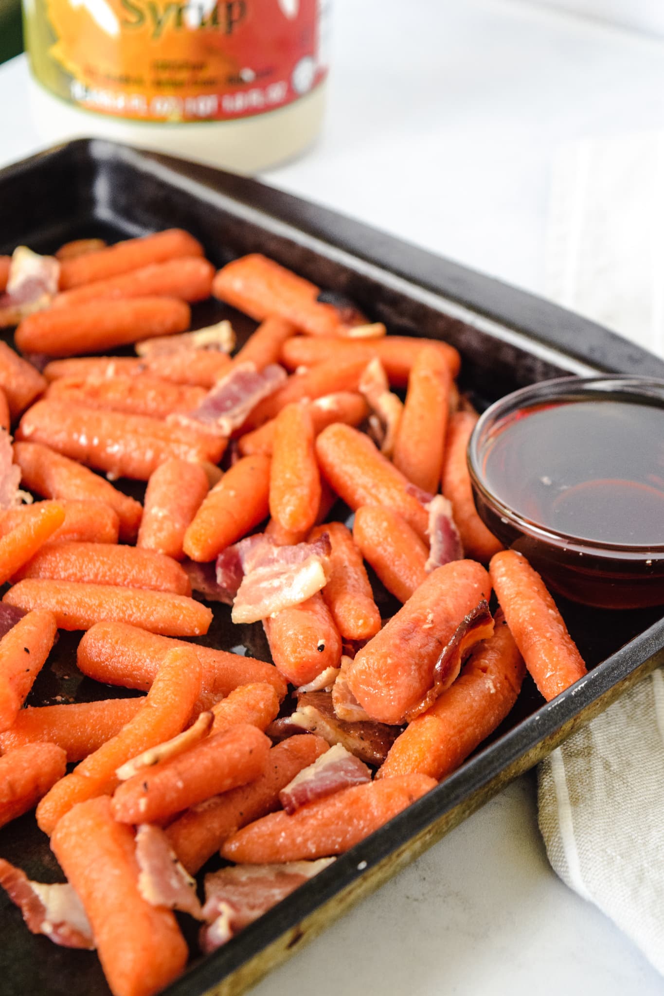 Baby Carrots on Sheet Pan with Bacon and Maple Syrup