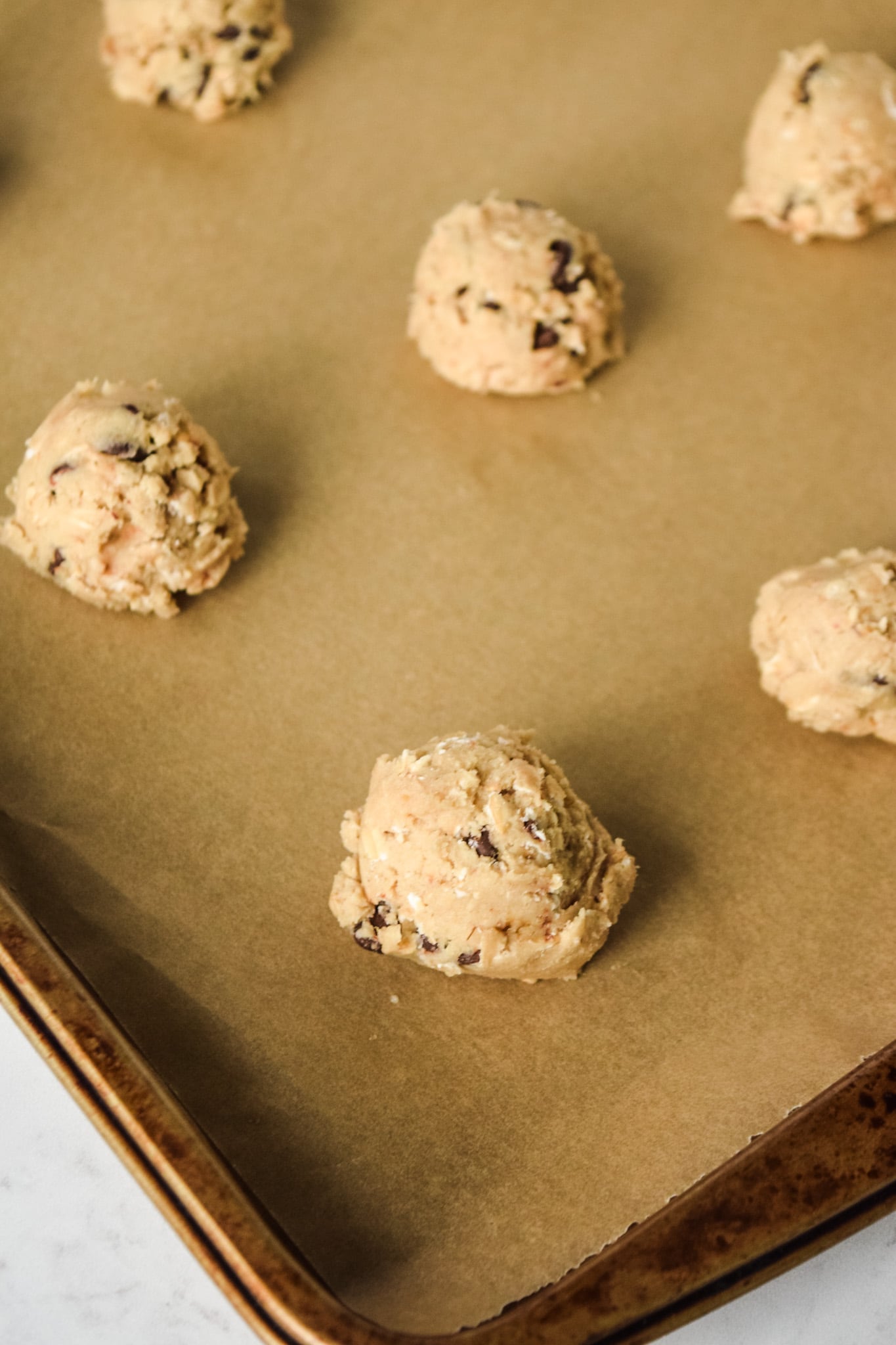 Gluten free chocolate chip cookie dough on baking sheet