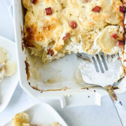 Simple scalloped potatoes in a crate and barrel white baking dish