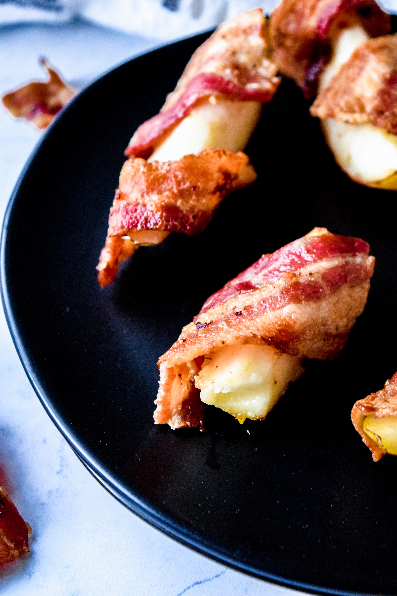 Bacon and Pear Holiday Appetizer on a Black Plate
