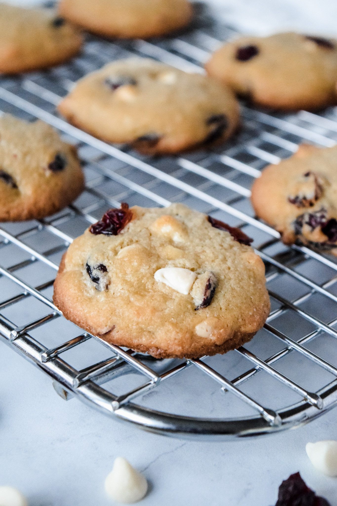 Close Up of Gluten Free White Chocolate Cranberry Cookie on Cooling Rack