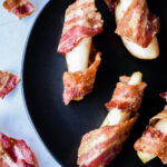 Pear and Bacon Bites on a Black Plate