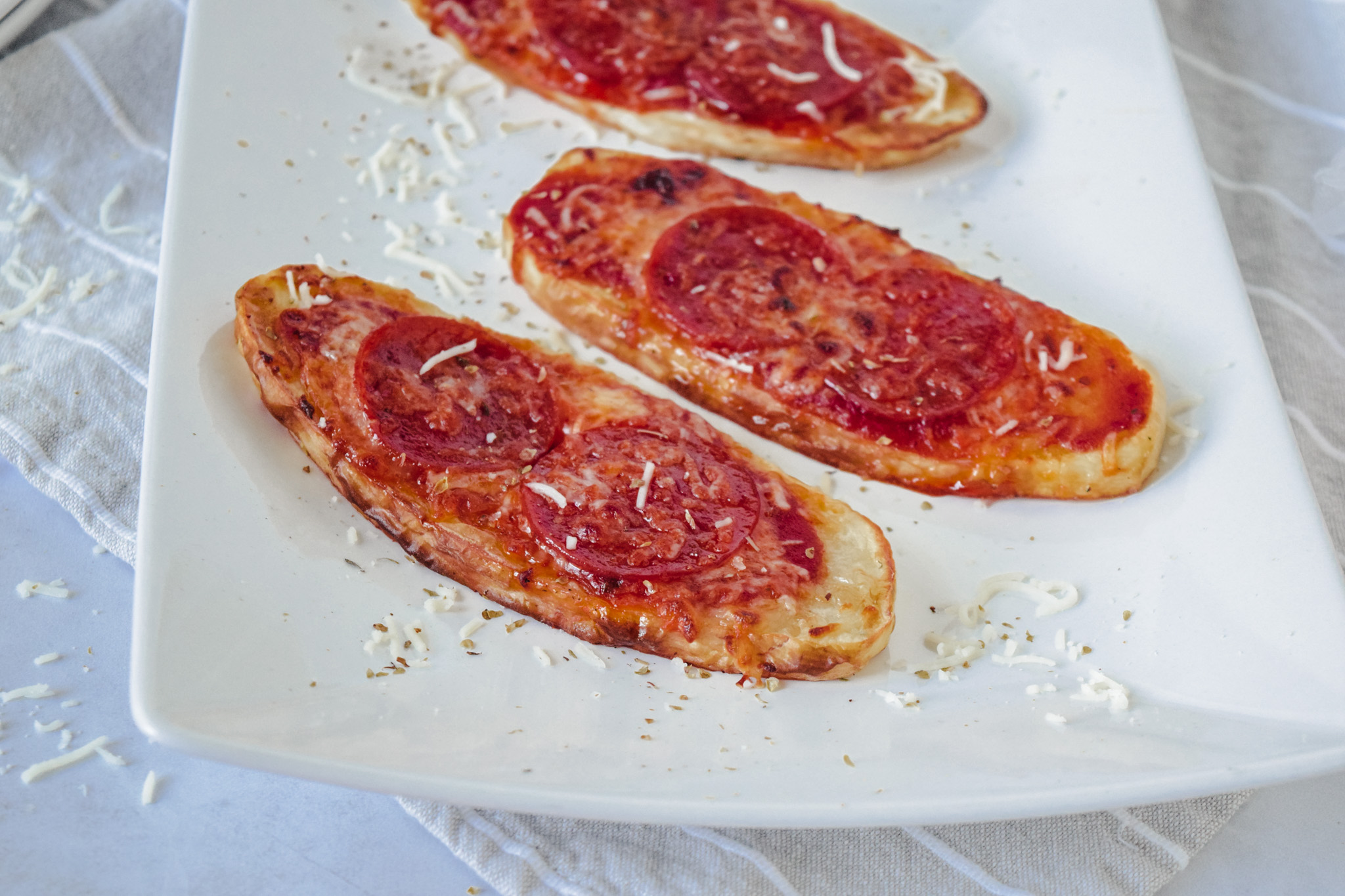 Broiled potato planks with pepperoni