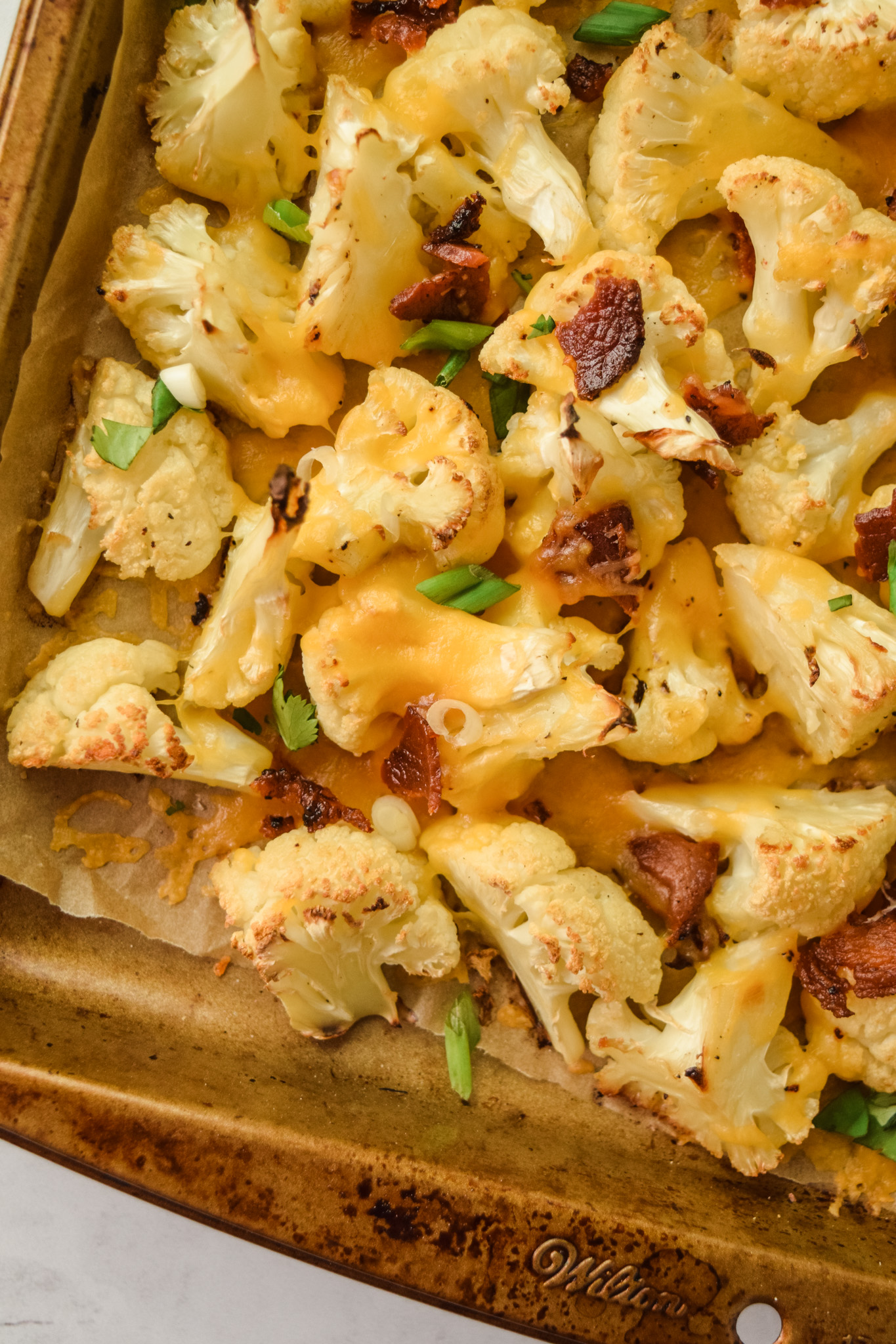 Roasted Cauliflower Sheet Pan with Bacon and Cheddar Cheese