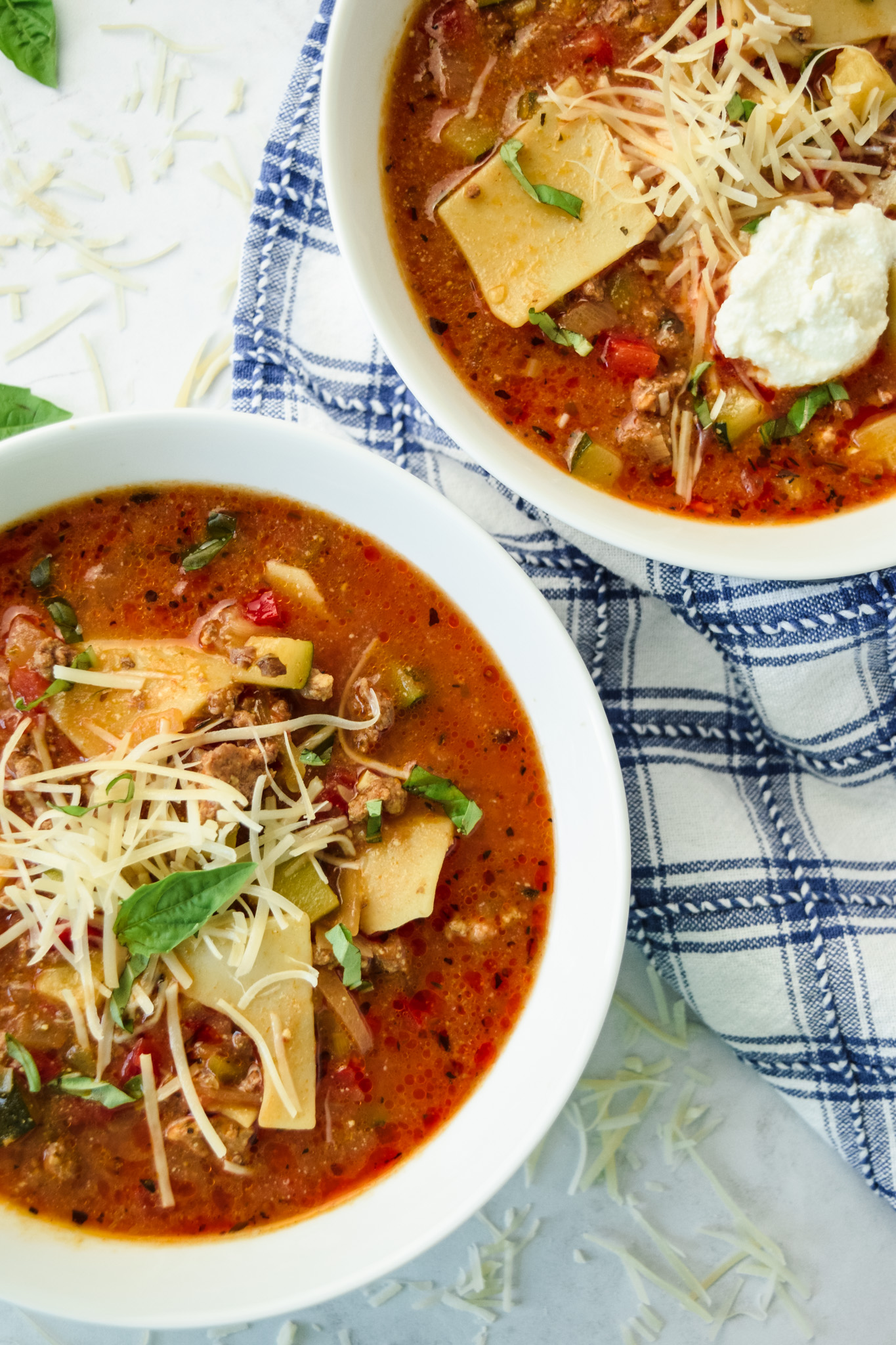 White bowls with gluten free lasagna soup