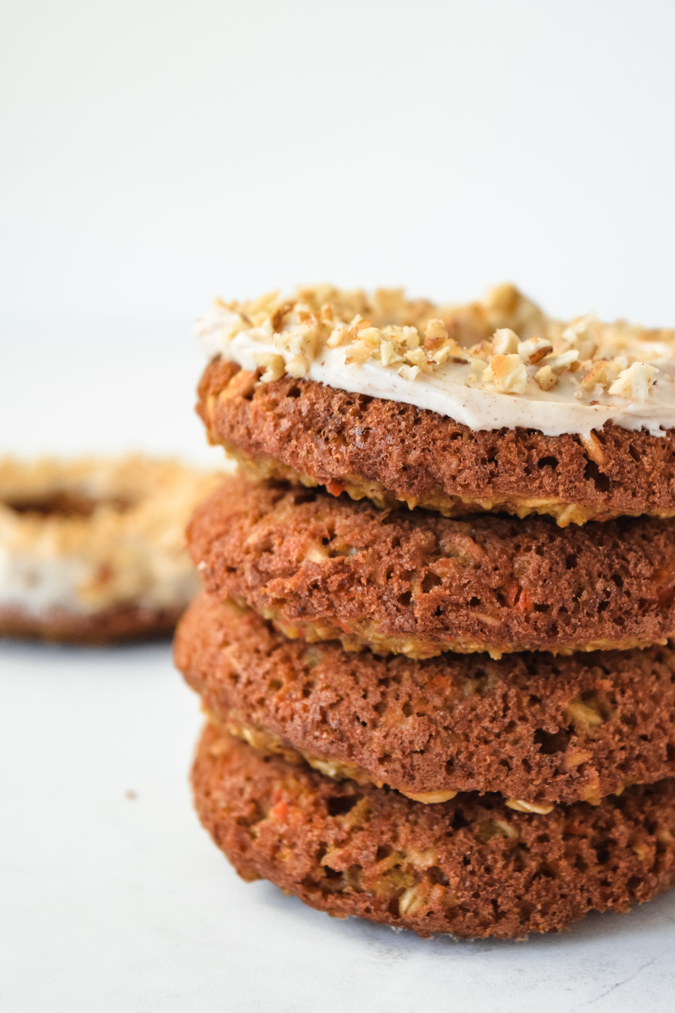 Stack of Gluten Free Carrot Cake Doughnuts with Cream Cheese Frosting