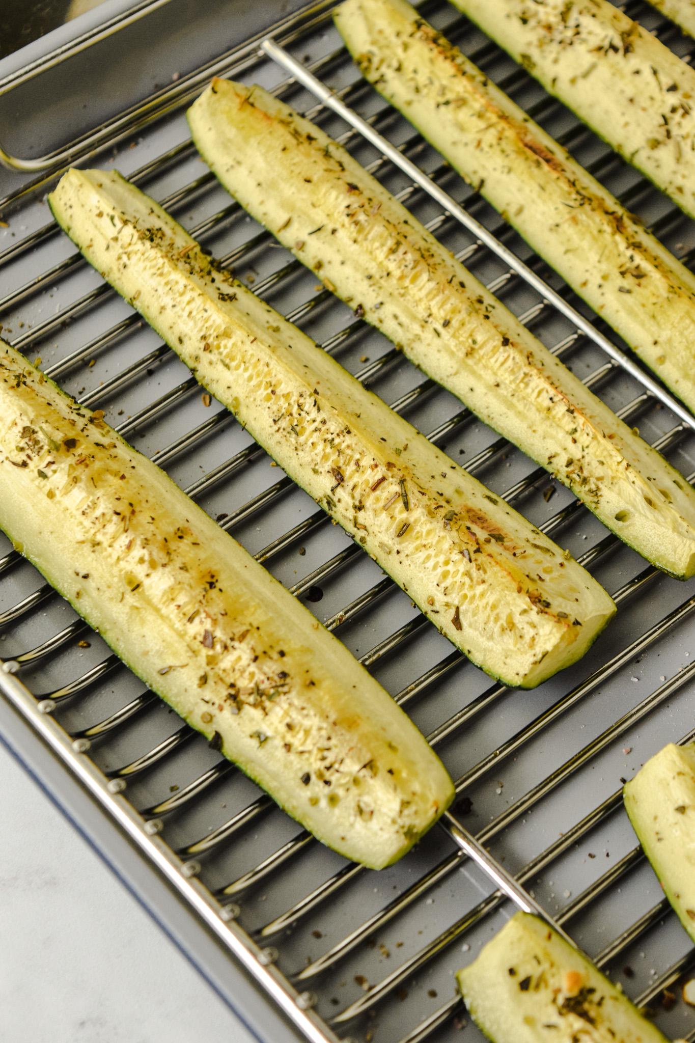 Broiled Zucchini Spears on a Baking Sheet with a Rack