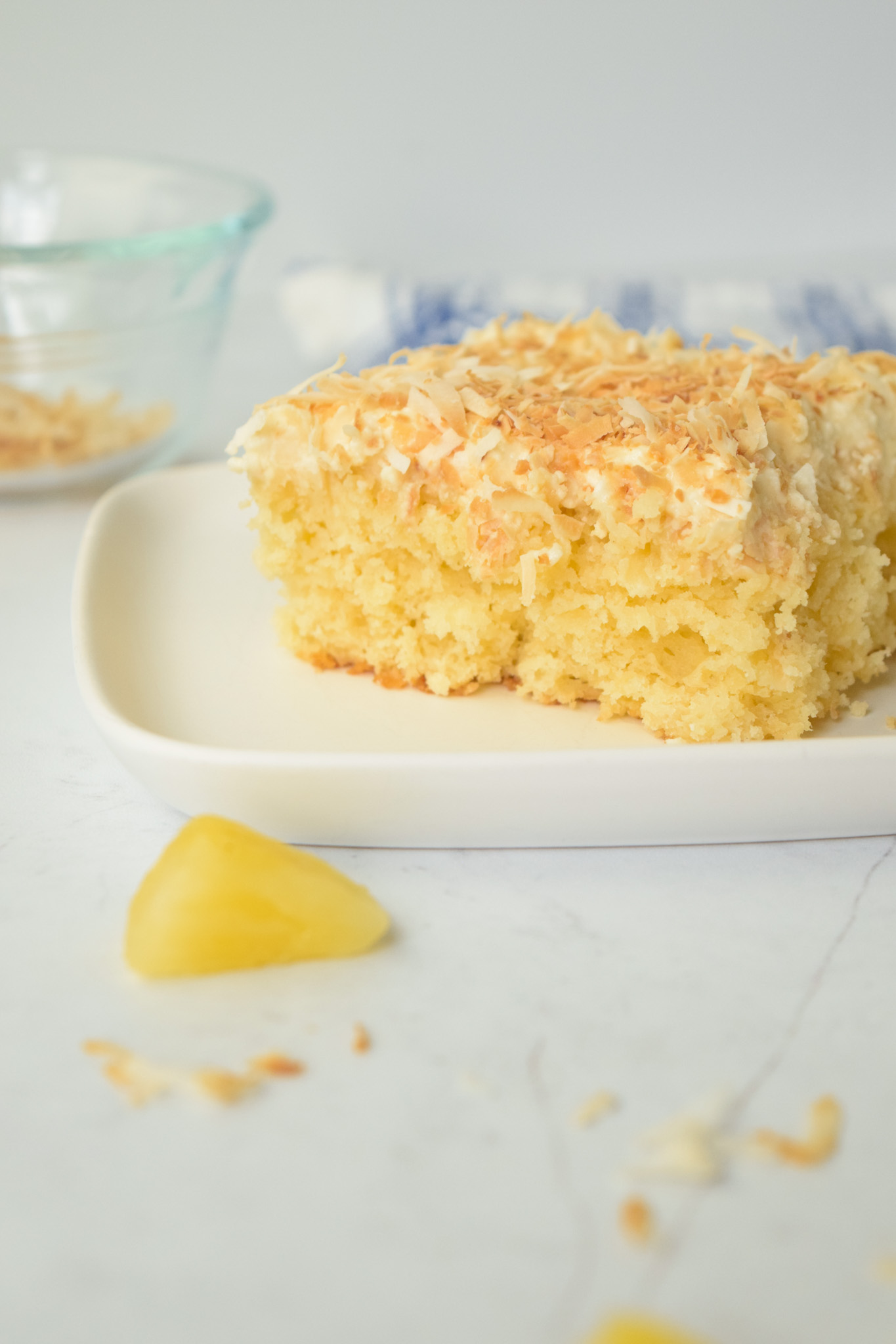 Slice of GF Pina Colada Cake with Toasted Coconut