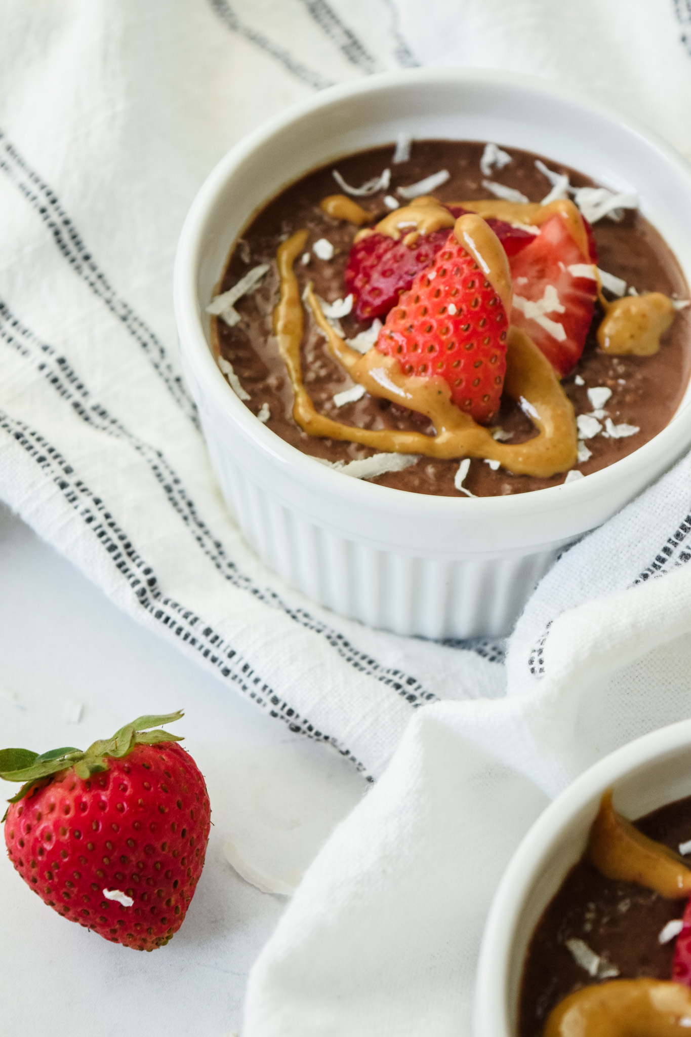 Chocolate Chia Pudding with a Peanut Butter Drizzle and Strawberries