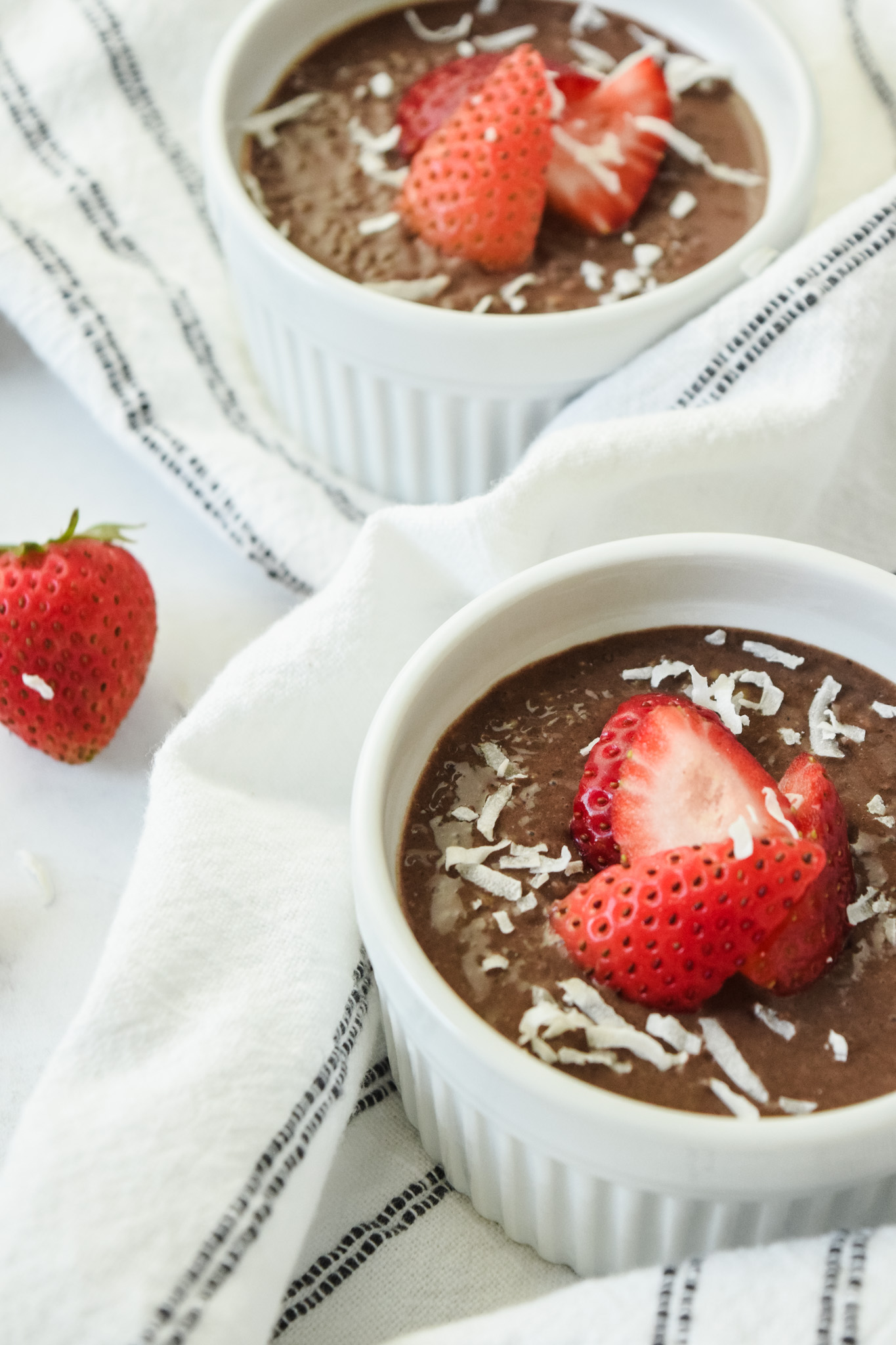 Chocolate Chia Pudding with Coconut Flakes and Strawberries