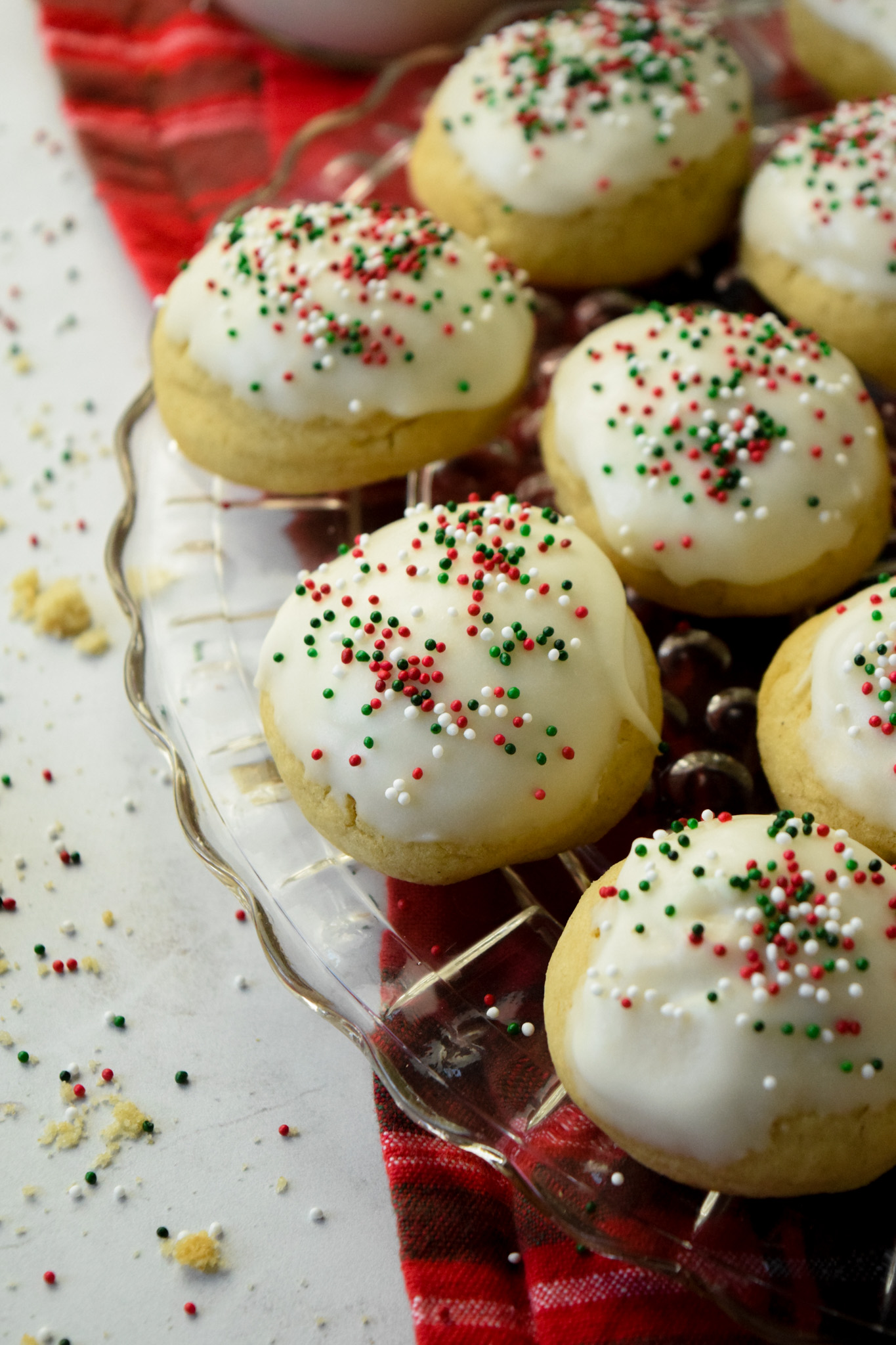 plate of gluten free italian christmas cookies with red and green sprinkles