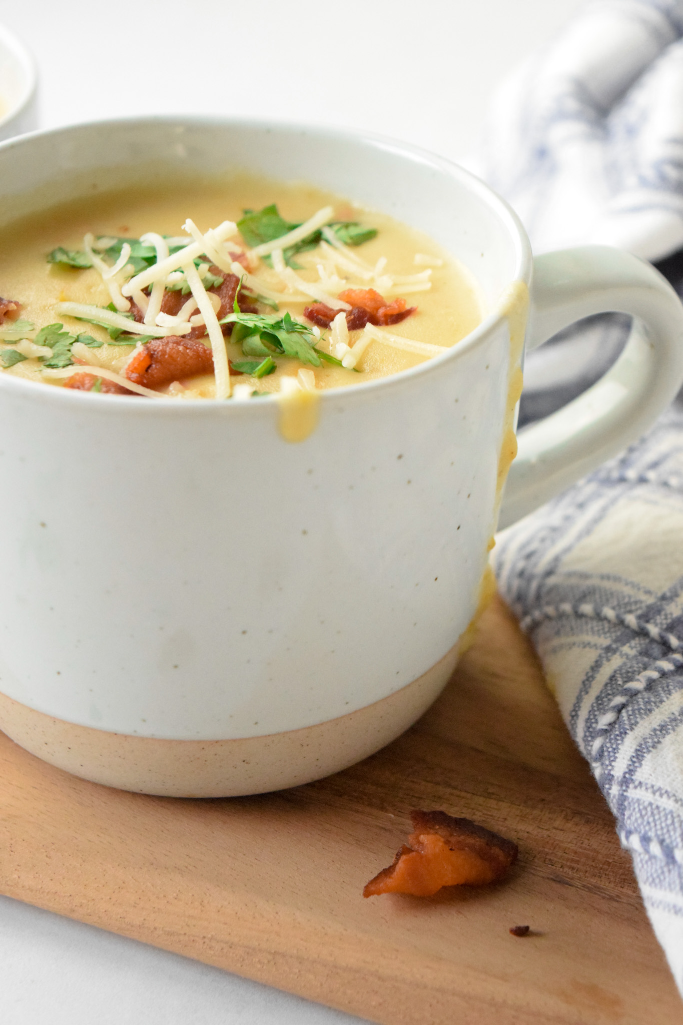 Mug of Instant Pot Potato Soup with Bacon and Cheese