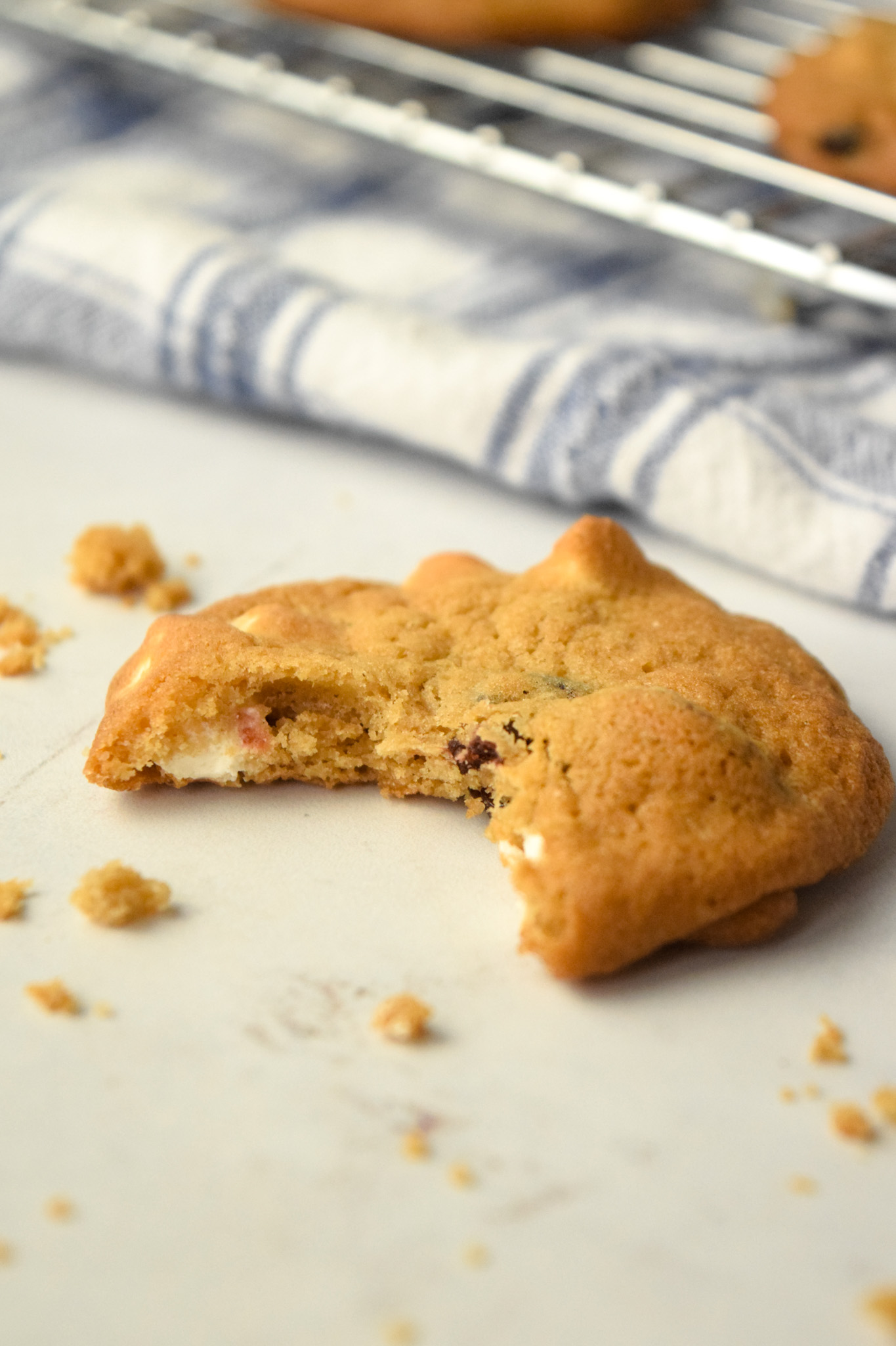 Bite missing from gluten free cranberry white chocolate chip cookie