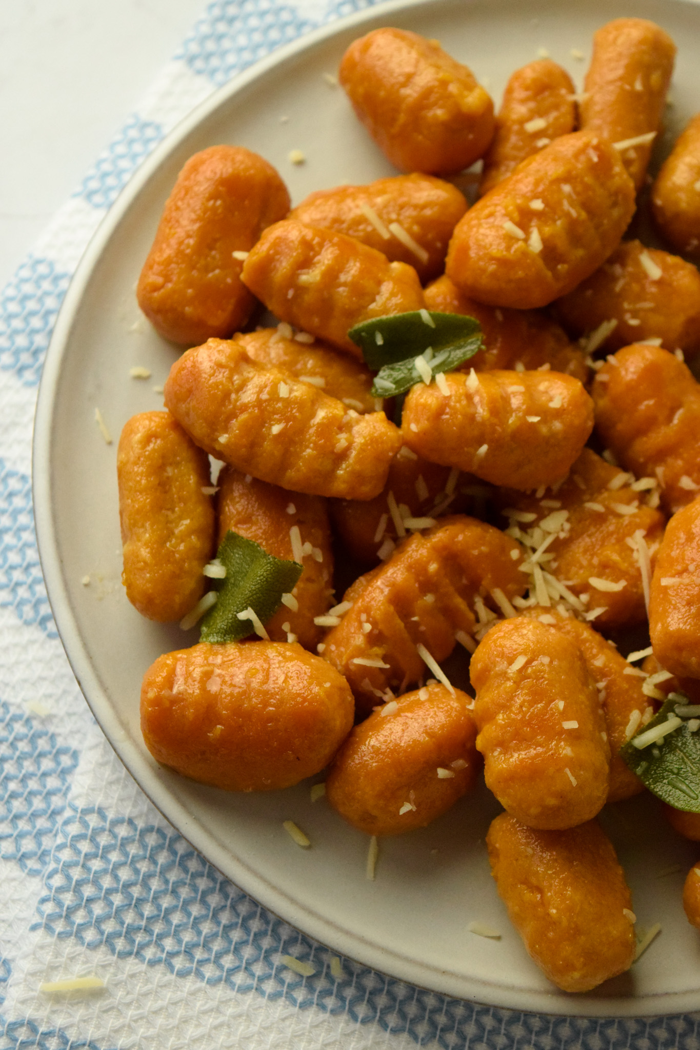Plate of Sweet Potato Gnocchi in a Butter Sage Sauce with Parmesan Cheese