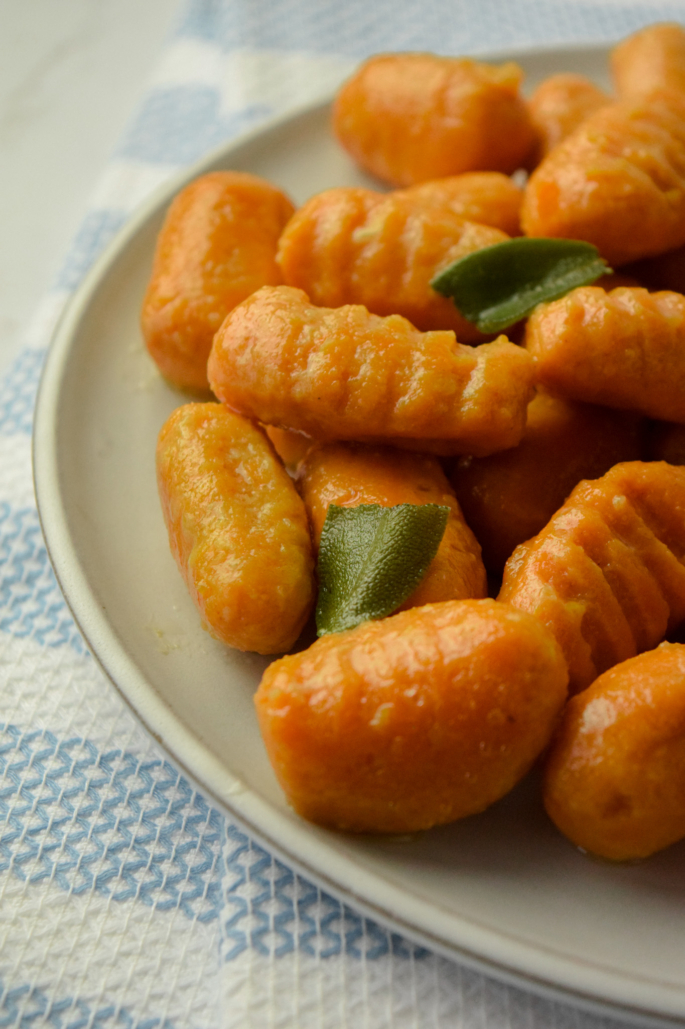 Plate of Gluten Free Sweet Potato Gnocchi with Sage Leaves