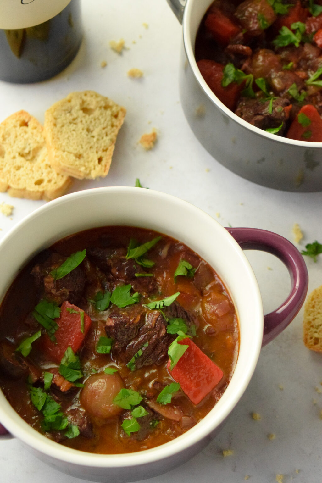 French beef stew with red wine in a crock