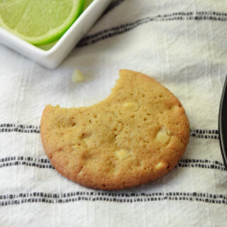 gluten free key lime cookie with white chocolate chips and a bite missing
